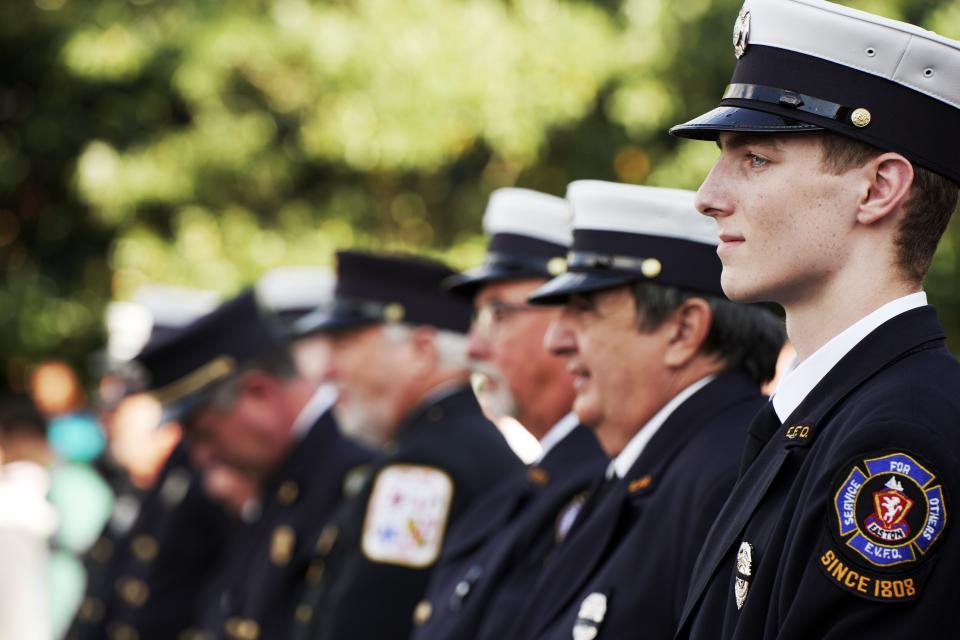 Members of local Fire Department and Police Force stand at attention during the 9/11 Day of Remembrance Ceremony. Photo courtesy of Town of Easton/Greg Mueller.