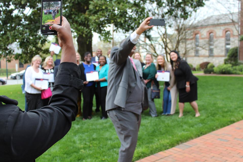 Will Homes takes a selfie with the graduates.