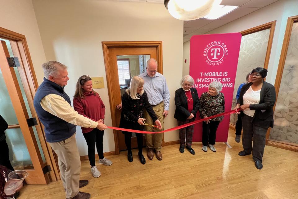 Cutting the ribbon for the Talbot County Senior Center at Brookletts updated computer lab.