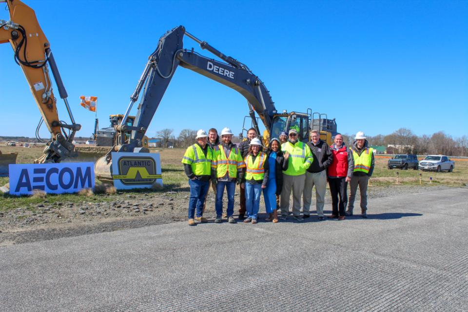 Micah Risher, Easton Airport Manager, and Assistant Secretary Jawauna M. Greene (center) are joined by Easton Airport, AECOM, MDOT, and Atlantic Contracting &amp; Materials staff.