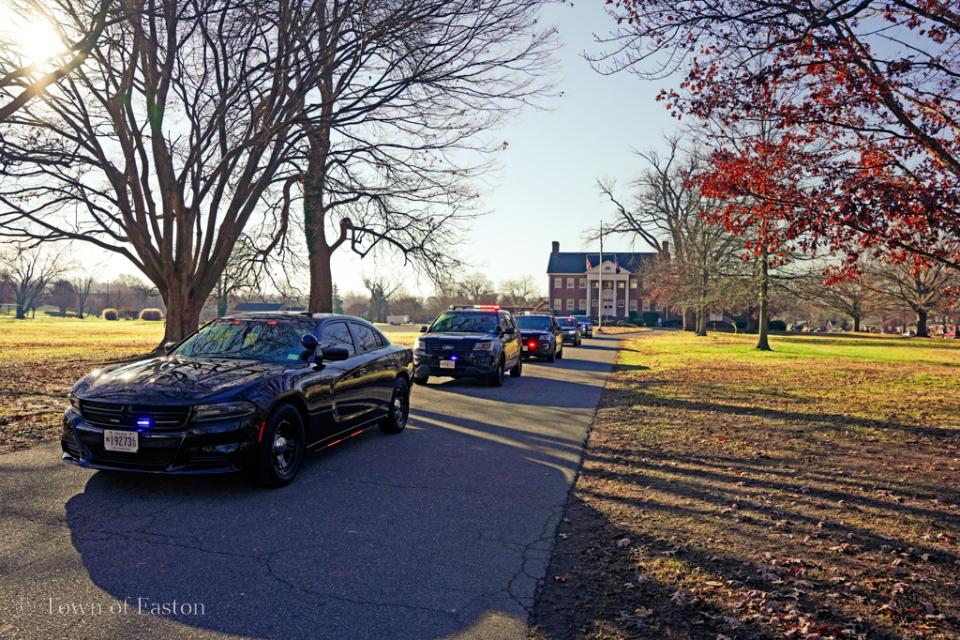 Easton Police Department, Oxford Police Department, and Talbot County Sheriff&#039;s Office squad cars depart with lights and sirens from the Elks Lodge #1622 on Dutchman&#039;s Lane in Easton to begin their shopping.