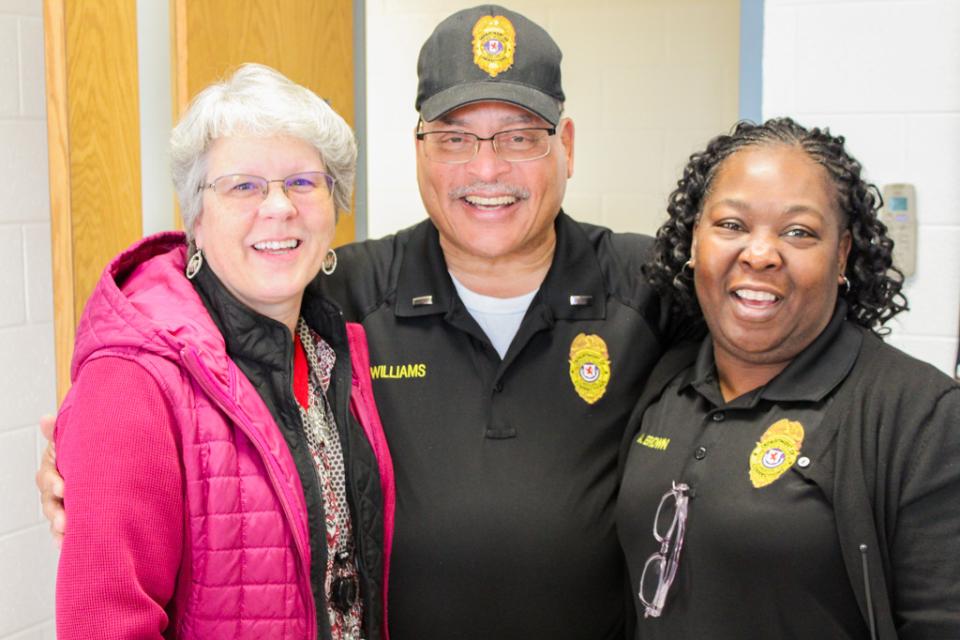 Former Correction Staff Member Mary Kay Verdery (left) and Corrections Staff Member Athena Brown share old jail stories with Lt. Williams.