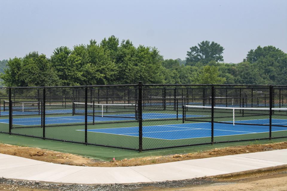 The new facility features eight individually fenced-in playing surfaces. While the courts are open now, the County aims to add a couple more items before the project is officially complete.