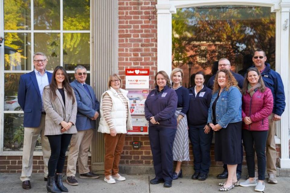 Talbot Paramedic Foundation, Talbot Emergency Services, Bluepoint Hospitality, and others stand in front of new AED station in downtown Easton.
