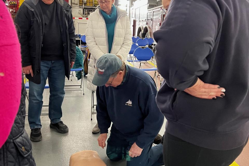 Residents learn techniques of CPR in a previous training.