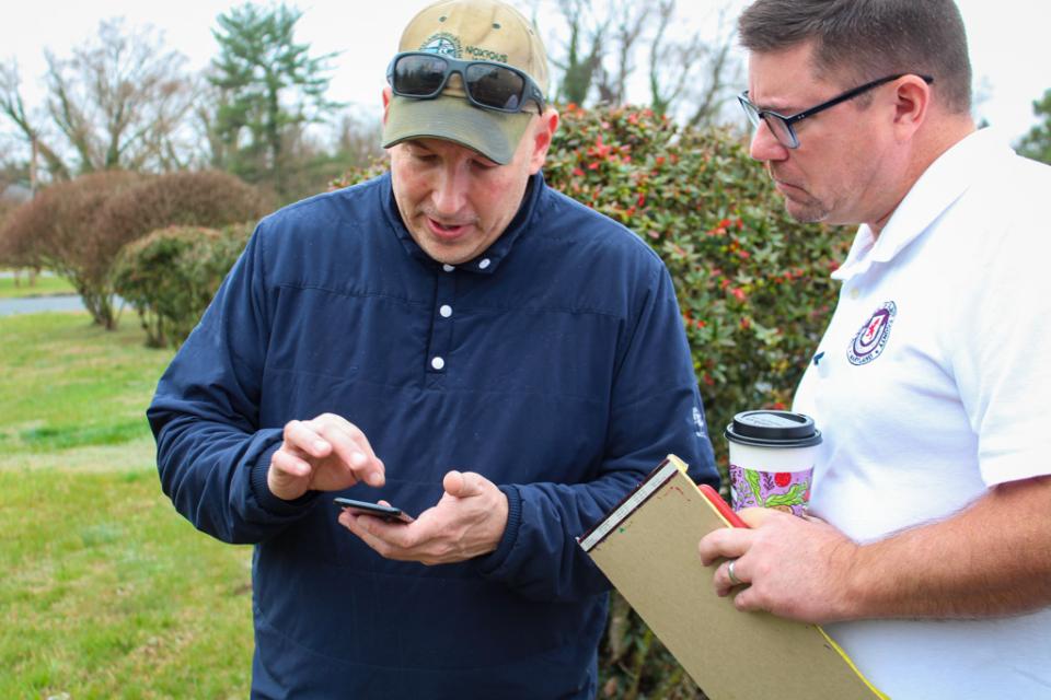 Joe Willoughby, Weed Control Coordinator for Talbot County Roads Department, discusses noxious weed he has found around the county with Talbot County Council Member, Dave Stepp.